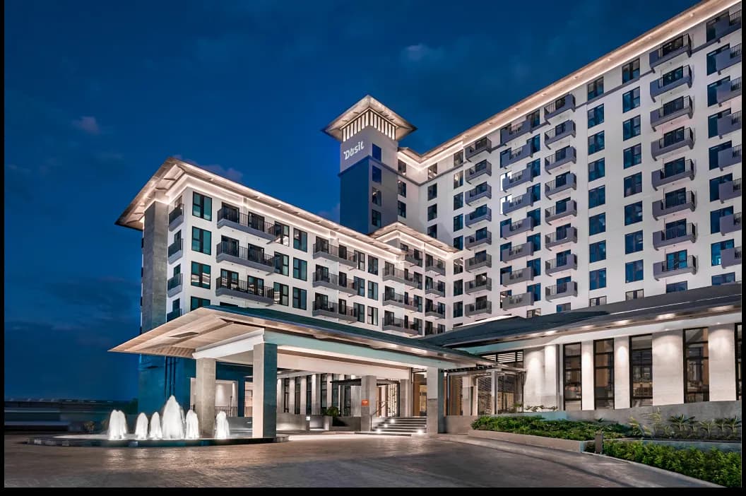 A Torre Lorenzo hospitality development illuminated at dusk.